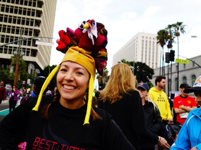 Jazmin Ortega models a turkey hat crafted for her by her sister. Ortega said the legs flapped in her face while running in the Nov. 28, 2013 Turkey Trot LA. in Downtown Los Angeles.