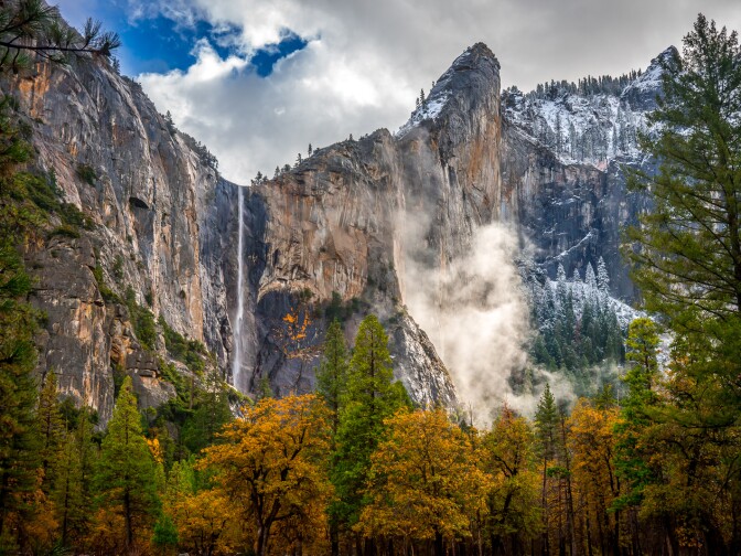 One of the joys of autumn is the mix of weather that can be found. The day before I 
shot this image, I was relaxing on the beach next to the Merced River in flip-flops and 
surf shorts. Less than 24 hours later, a snow storm had moved through the valley and 
coated the upper half of Yosemite with a blanket of white. As the sun began to burn 
through the clouds, the landscape turned into a fantasy world of fog, color, light and 
snow. Yosemite National Park, California.