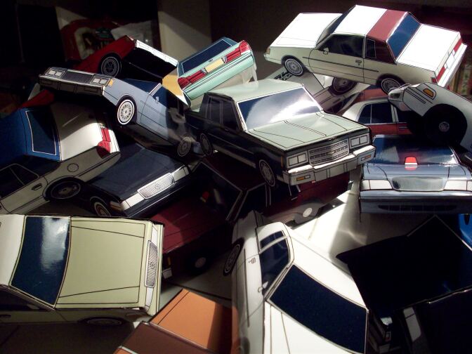 A toy car pileup mimics a car crash.