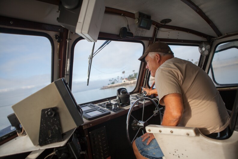 Capt. Gordon Boivin, marine operations manager for USC's operations on Catalina, pilots the Miss Christi toward Catalina Island on Monday, July 29.
