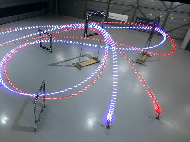 Using reinforcement learning, the drone (blue) taught itself a faster way around the course than its human opponent (red).
