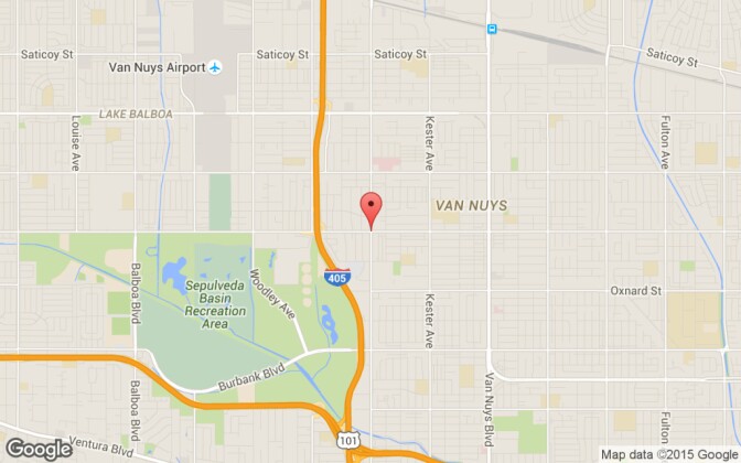 The intersection of Victory Boulevard and Sepulveda Boulevard in Van Nuys, where police shot and killed a suspect after having their rear window shattered on Saturday, Oct. 3, 2015.