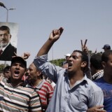 CAIRO, EGYPT - JULY 5: Supporters of former Egyptian President Mohammed Morsi demonstrate in front of the headquarters of the Egyptian Republican Guard in Nasr City in Cairo, Egypt.  (Photo by Ed Giles/Getty Images). 