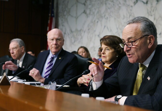 Sen. Charles Schumer (D-NY)(R), speaks while flanked by Sen. Dianne Feinstein (D-CA)(2nd-R), Chairman Patrick Leahy (D-VT)(2nd-L) and Sen. Chuck Grassley (R-IA)(L) during a Senate Judiciary Committee hearing on April 22, 2013 in Washington, DC.The committee is hearing testimony on border security, economic opportunities and the Immigration Modernization Act.  
