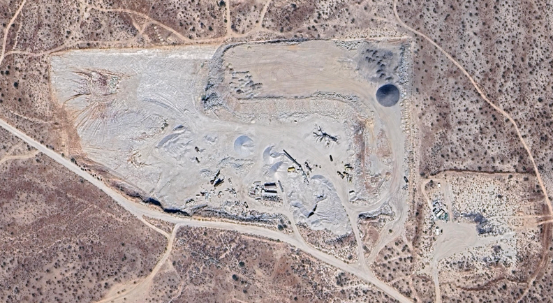 Satellite image showing desert interrupted by mining.