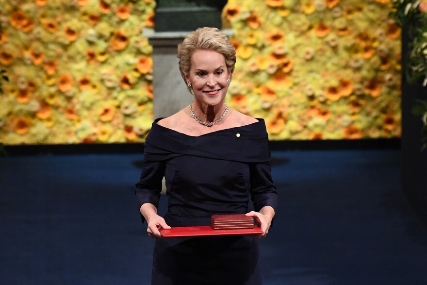 Co-laureate of the 2018 Nobel Prize in Chemistry US chemical engineer Frances Arnold, poses with her Nobel Prize during the Award ceremony 2018 on December 10, 2018 at the Concert Hall in Stockholm, Sweden.