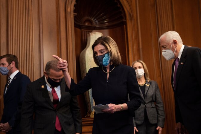Speaker of the House Nancy Pelosi (D-CA) (C) arrives with Democratic leadership and impeachment managers to sign an article of impeachment during an engrossment ceremony on Capitol Hill charging US President Donald Trump with "incitement of insurrection" for his role in inciting a mob who broke into the Capitol last week, January 13, 2021, in Washington, DC. - Donald Trump on January 13 became the first US president to be impeached for a second time, when a bipartisan majority in the House of Representatives voted to charge him with inciting last week's attack on the US Capitol. (Photo by Brendan Smialowski / AFP) (Photo by BRENDAN SMIALOWSKI/AFP via Getty Images)