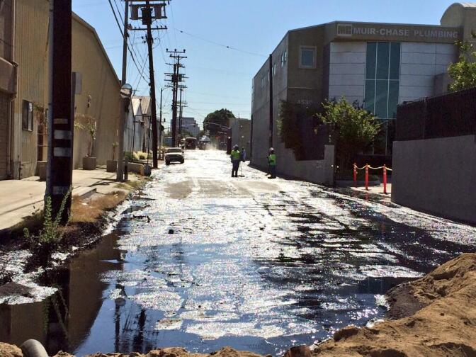 Crude oil being cleaned up on Brazil Street after an oil spill in Atwater Village on Thursday, May 15, 2014.