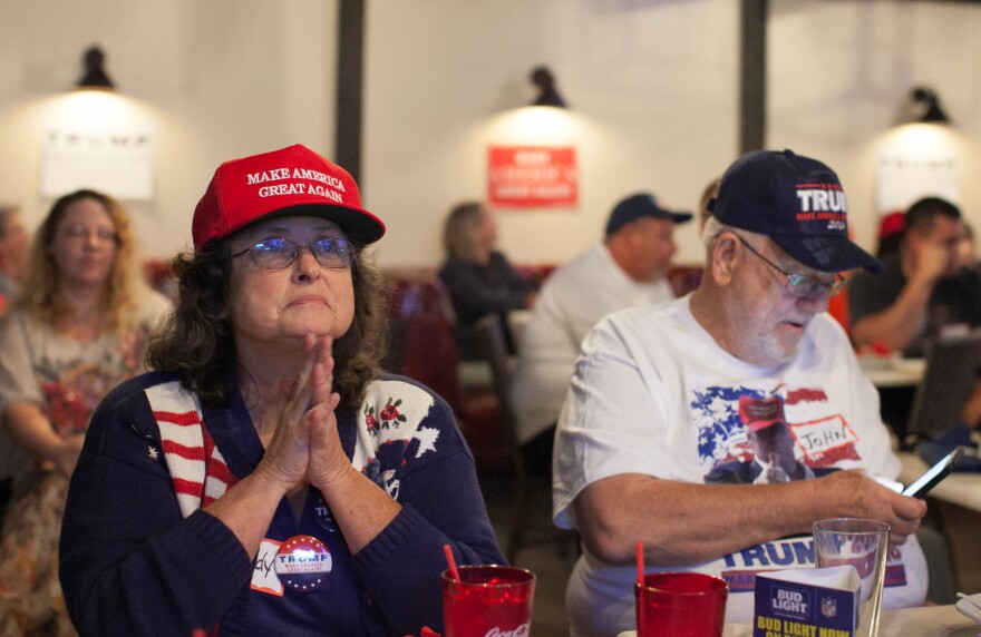 Melody Reid, left, watches the second presidential debate at JJ's Bar & Grill in Santa Clarita, Calif. on Sunday, Oct. 9, 2016.