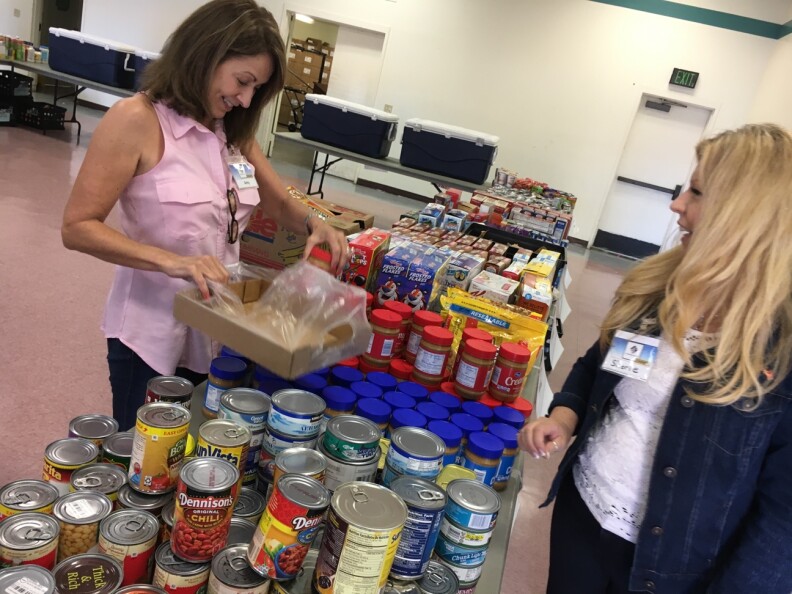 Volunteers with the Saddleback Church set out donated food as part of its monthly food pantry on the Camp Pendleton Marine Base near San Diego, April 5, 2017. A Government Accountability Report in July 2016 found that the food pantry services at Camp Pendleton were the most extensive of those at military bases and installations across the country.