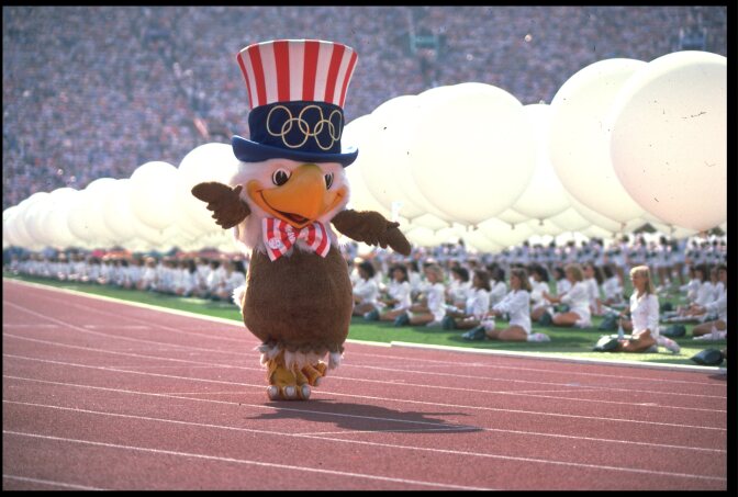 File: Sam the Eagle, the mascot of the 1984 Los Angeles Olympics, marches around the stadium during the opening ceremony on July 28, 1984. 