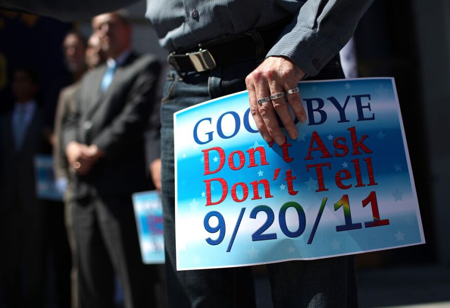 A man holds a sign in support of the end of "don't ask, don't tell" on September 20, 2011 in San Francisco, California.  The end of the 18 year-old law "Don't Ask Don't Tell" took effect today now allowing gays to openly serve in the armed forces.   