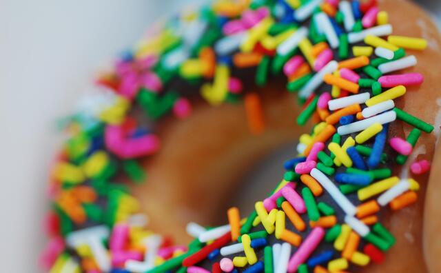 A donut with rainbow sprinkles.