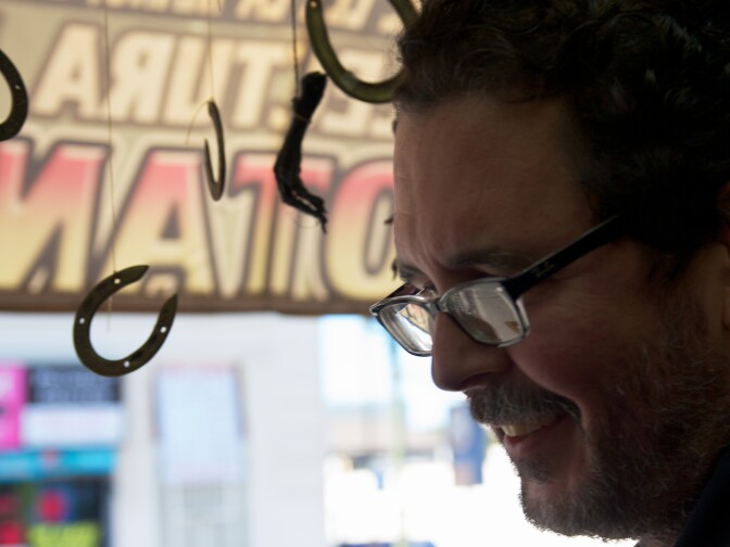 Richard Lange browses the wares inside of the botanica. 