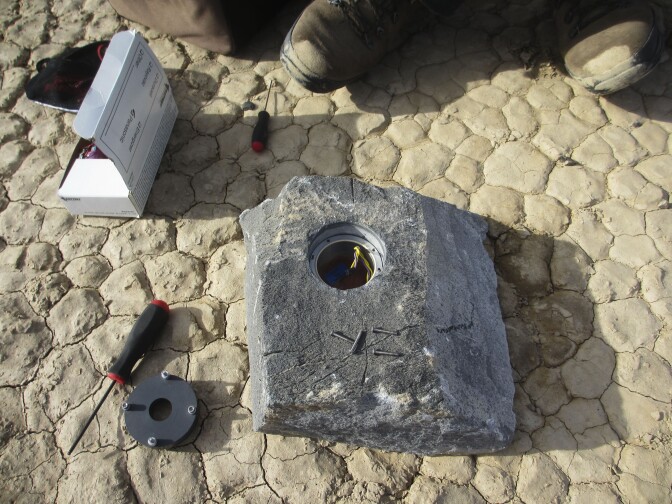 The cavity in this rock will carry the GPS instrument package and its battery pack across the desert.