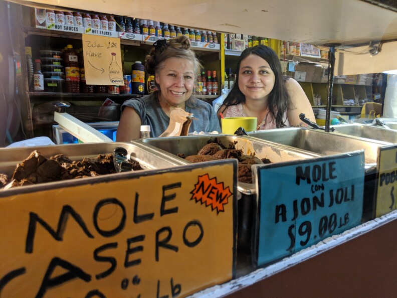 Claudia Armendariz (R) runs Chiles Secos in Grand Central Market. Her late-grandfather opened it in 1975, and her whole family has taken part in the operations including Armendariz's aunt Rocio Lopez (L)