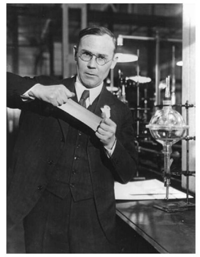 Wallace Hume Carothers demonstrating the elastic properties of neoprene. 