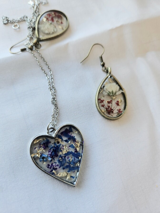 Jewelry shaped like hearts and teardrops, with flower designs.