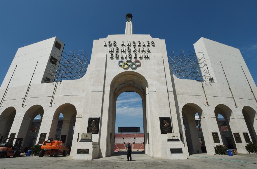 The Los Angeles Memorial Coliseum, venue for two previous Olympic Games, is seen in this on August 26, 2015 in Los Angeles, California. The Coliseum would be renovated and used as the main stadium if the city bids for the 2024 Summer Olympics. The Los Angeles city council is reviewing a $4.1 billion bid proposal for the 2024 Summer Olympics that backers say could produce a surplus of $161 million if the city is awarded a third Summer Games. A 218-page bid book made public on August 25 shows plans for a Los Angeles Games rely on private-sector partners to pay more than $1.7 billion in venue costs and includes revenue projections such as $4.8 billion from ticket sales, broadcast rights and corporate sponsorships.       AFP PHOTO / MARK RALSTON        (Photo credit should read MARK RALSTON/AFP/Getty Images)