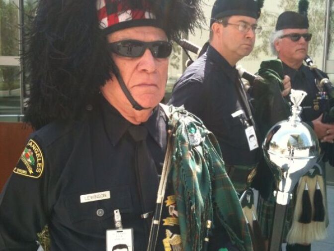 A member of the Los Angeles Police Emerald Society attends the LAPD's annual memorial honoring officers who have died in the line of duty.