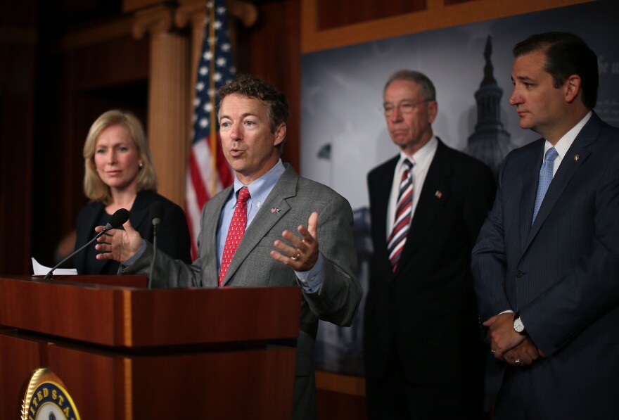 U.S. Sen. Rand Paul (R-KY) (C) speaks while flanked by U.S. Sen. Kirsten Gillibrand (D-NY) (L) U.S. Sen. Charles Grassley (R-IA) (2nd-R) and U.S. Sen. Ted Cruz (R-TX) (R)  during a news conference on sexual assault in the military, July 16, 2013 in Washington, DC. U.S. Sen. Gillibrand announced the support of 34 senators that will co-sponsor her proposal to take the decision whether to prosecute sexual assaults out of the hands of the military chain of command.  