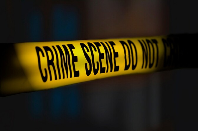 Photo illustration of crime scene yellow tape