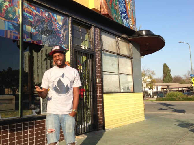 Rapper Nocando in front of the Kaos Network in Leimert Park.