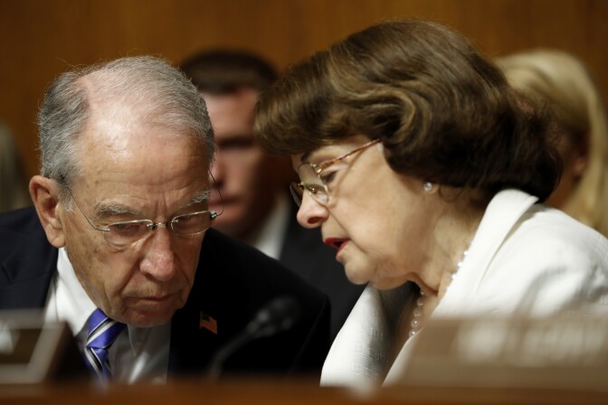 Senate Judiciary Committee Chairman Sen. Chuck Grassley, R-Iowa, talks with the Committee's ranking member Sen. Dianne Feinstein, D-Calif., on Capitol Hill in Washington, Wednesday, July 12, 2017, during the committee's confirmation hearing for FBI Director nominee Christopher Wray.  (AP Photo/Pablo Martinez Monsivais)