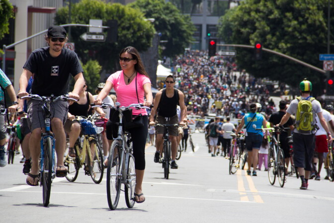File: Riders climb Wilshire Boulevard in downtown L.A. during the seventh CicLAvia event on June 23, 2013.