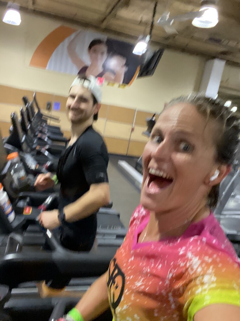 Erika Lilley and JD Rios on treadmills in a gym