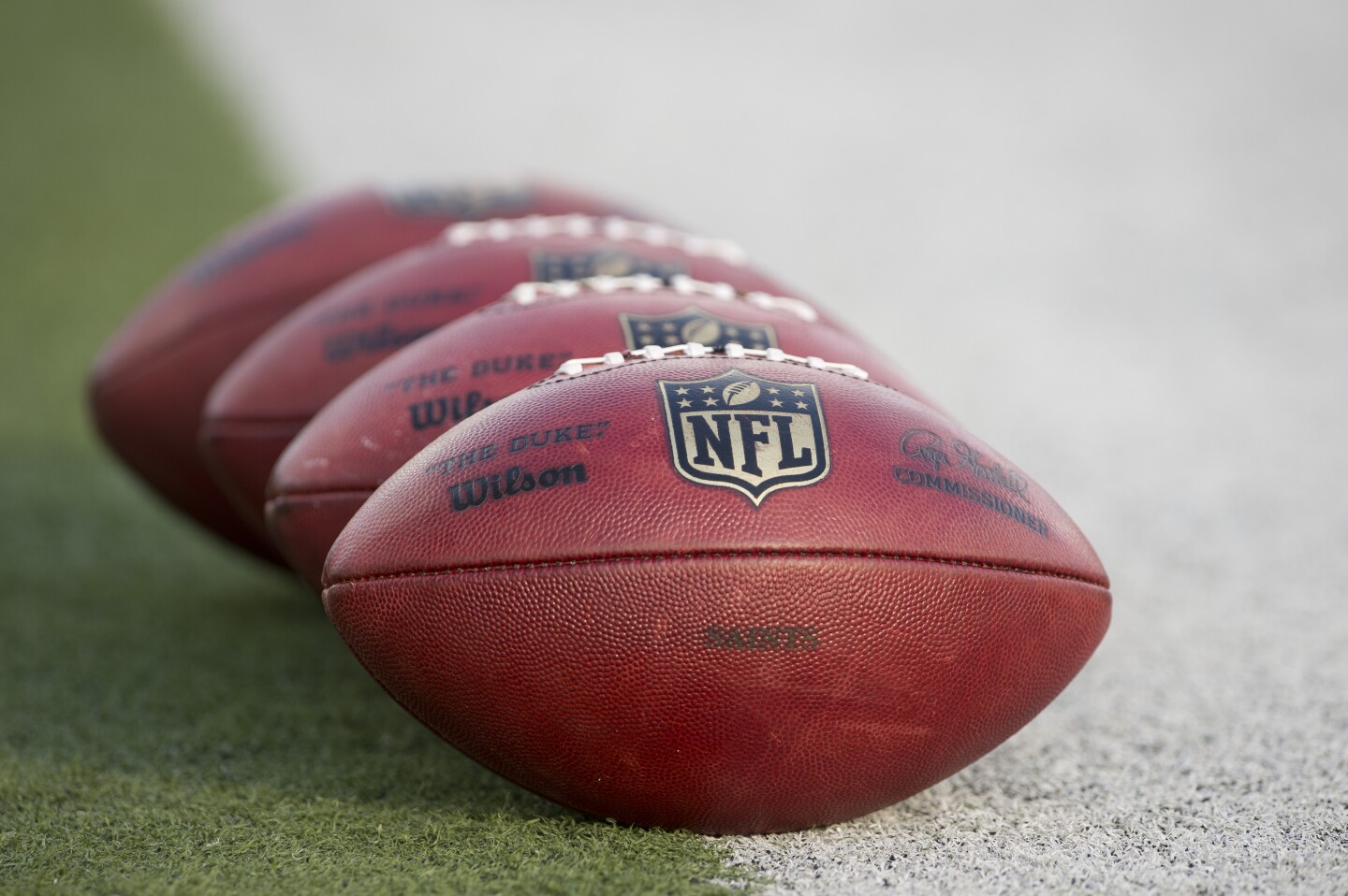 CANTON, OH - AUGUST 5: Official NFL footballs sit on the sideline prior to the start of the game between the New Orleans Saints and the Arizona Cardinals during the Pro Football Hall of Fame game at Fawcett Stadium on August 5, 2012 in Canton, Ohio. (Photo by Jason Miller/Getty Images)