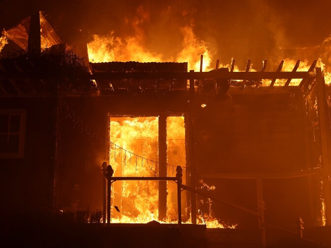 OJAI, CA - DECEMBER 07:  A home is consumed by fire during the Thomas fire on December 7, 2017 in Ojai, California. The Thomas fire has burned over 115,000 acres and has destroyed 439 structures.  (Photo by Justin Sullivan/Getty Images)