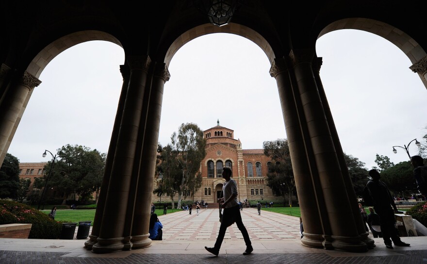 LOS ANGELES, CA - APRIL 23:  A student walks near Royce Hall on the campus of UCLA on April 23, 2012 in Los Angeles, California. According to reports, half of recent college graduates with bachelor's degrees are finding themselves underemployed or jobless.  (Photo by Kevork Djansezian/Getty Images)