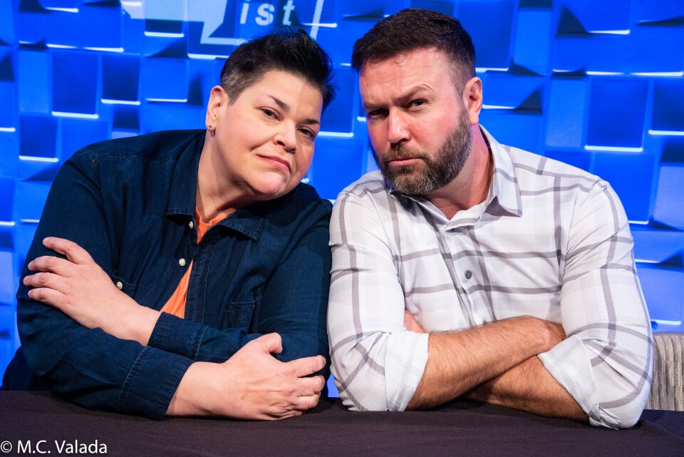 Jen Kober and Taran Killam making sneering faces on the panelist table