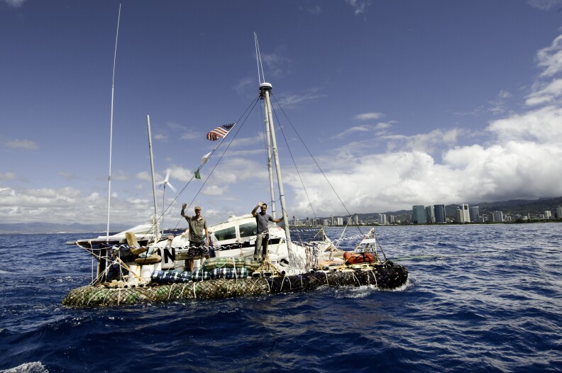 "Junk" vessel -- made of 15,000 plastic bottles and other discarded materials -- arrives at Ala Wai, Oahu from 87 day voyage, 2.600 miles, across the Pacific (from Long Beach, California) to raise awareness about plastic pollution in the world's oceans; July 27, 2008