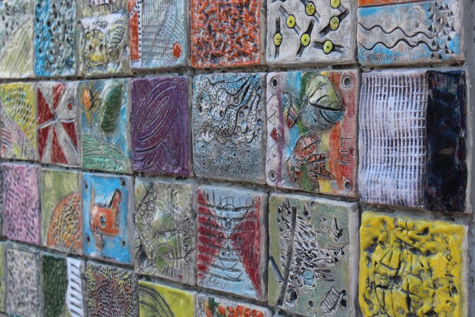 Kids with and without special needs worked together to design the ceramic tiles that make up this mural.
