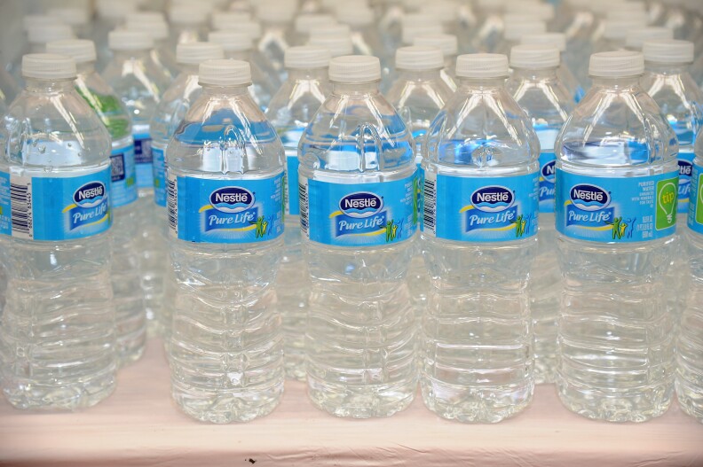 Nestle's many products include bottled water.  (Photo by Bryan Bedder/Getty Images for NYCWFF)