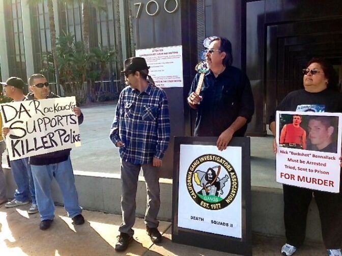 Genevieve Huizar (far right), the mother of Manuel Diaz, was among those protesting prosectors' decision not to charge an Anaheim officer in connection with a shooting last summer last sparked rioting.