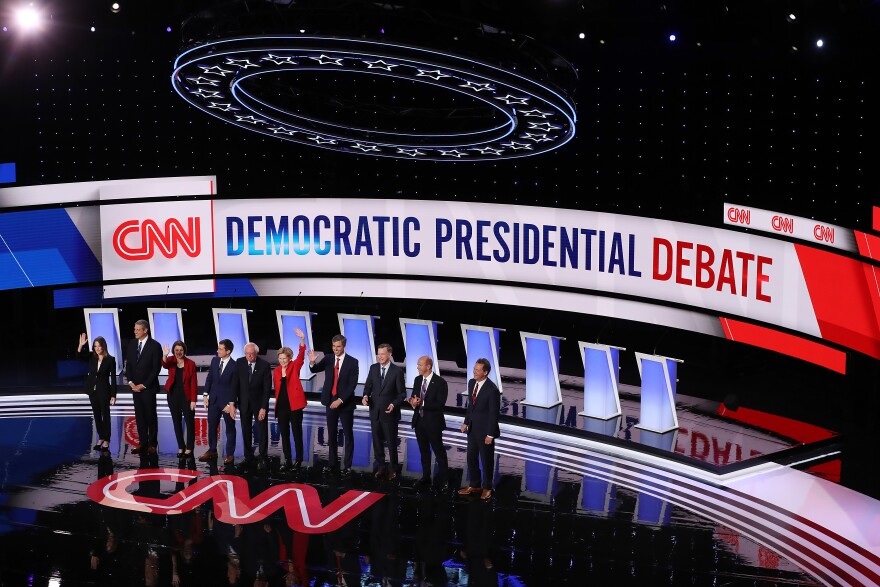 DETROIT, MICHIGAN - JULY 30: Democratic presidential candidates Marianne Williamson, (L-R),  Rep. Tim Ryan (D-OH), Sen. Amy Klobuchar (D-MN), Indiana Mayor Pete Buttigieg, Sen. Bernie Sanders (I-VT), Sen. Elizabeth Warren (D-MA), former Texas congressman Beto O'Rourke,  former Colorado governor John Hickenlooper, former Maryland congressman John Delaney, and Montana Gov. Steve Bullock 
take the stage at the beginning of the Democratic Presidential Debate at the Fox Theatre July 30, 2019 in Detroit, Michigan. 20 Democratic presidential candidates were split into two groups of 10 to take part in the debate sponsored by CNN held over two nights at Detroit’s Fox Theatre.  (Photo by Justin Sullivan/Getty Images)