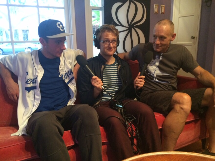 KPCC's Jacob Margolis mediates between 18-year-old Price Campbell, left, and his father, Marvin Campbell, right, about water use in their home.