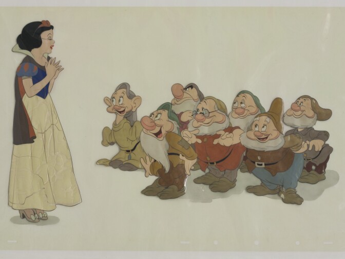 A cel of Snow White singing to the seven dwarfs from Snow White and the Seven Dwarfs exhibiting signs of cellulose plastic deterioration. © Disney Enterprises, Inc.