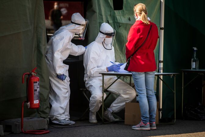PRAGUE, CZECH REPUBLIC - APRIL 23: A healthcare worker registers people before getting tested for the coronavirus in Prague on April 23, 2020. People have been forming long lines to get tested in a study to determine undetected infections with the coronavirus in the population. Some 27,000 people aged 18 - 89 across the country will be tested in the next two weeks, starting on Thursday. (Photo by Gabriel Kuchta/Getty Images)