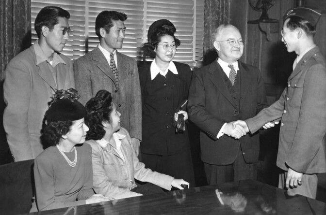 January 15, 1945: Mayor Bowron welcomes Japanese back to LA. L-R: (seated): Mrs. Melba Matsuuro, Mary Yoshimizu; (standing): Jack Yoshimizu, Henry Yoshimizu, Meriko Hoshigama, Mayor Bowron, and Harley M. Oka. Speaking on December 18, 1944, Mayor Bowron said he was fearful that the return of the Japanese might lead to a serious outbreak of race riots and impose a heavy burden on law officers. 

