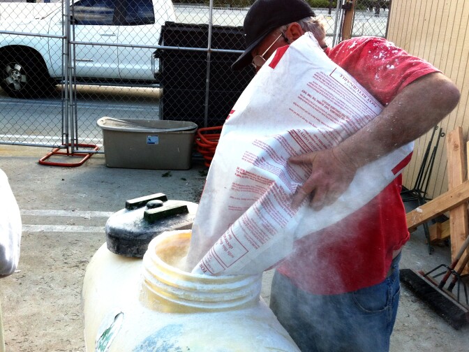 Cougar Mountain Christmas Trees' Bruce Morrison loads the Christmas tree flocking into the tank.