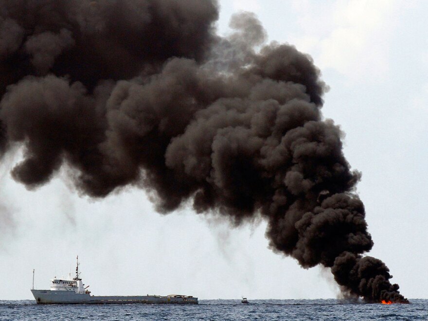 Smoke rises Friday, July 16, 2010, from a controlled burn of contained oil from the Deepwater Horizon oil well leak on the Gulf of Mexico near the coast of Louisiana.