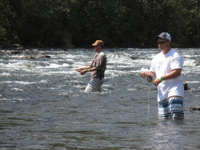 Sgt. Kurt Erickson and SSG. James Butler wade fishing in the Naches River while on a Rivers of Recovery trip.
