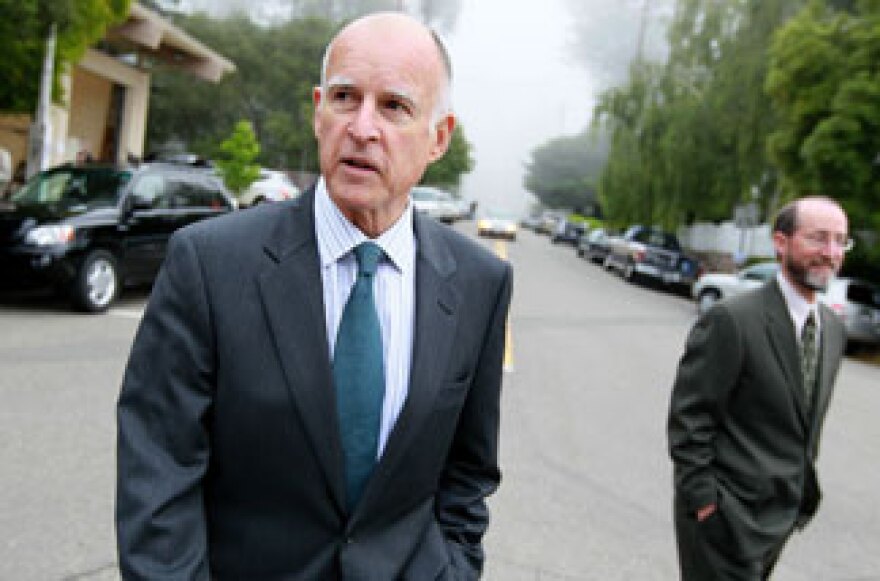 California Attorney General and democratic candidate for governor Jerry Brown (L) walks home with his campaign manager Steven Glazer after voting June 8, 2010 in Oakland, California.