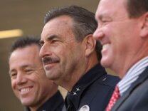 The three final candidates for the job of Los Angeles Police Chief, Deputy Chief Michel Moore, Deputy Chief Charlie Beck and Assistant Police Chief Jim McDonnell listen as Chief William Bratton holds his last press conference outside the new Police Administration Building on October 28, 2009.