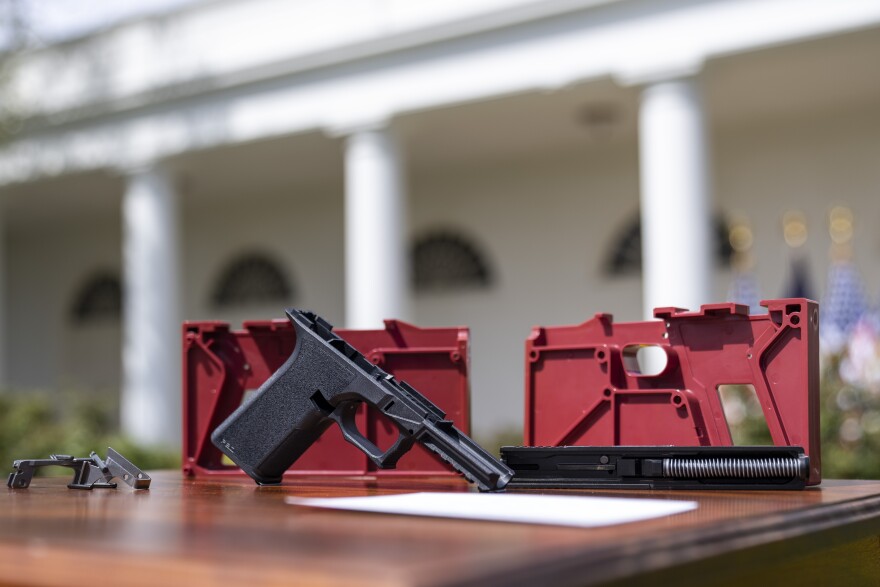 A 9mm pistol build kit with a commercial slide and barrel with a polymer frame is displayed at the White House.