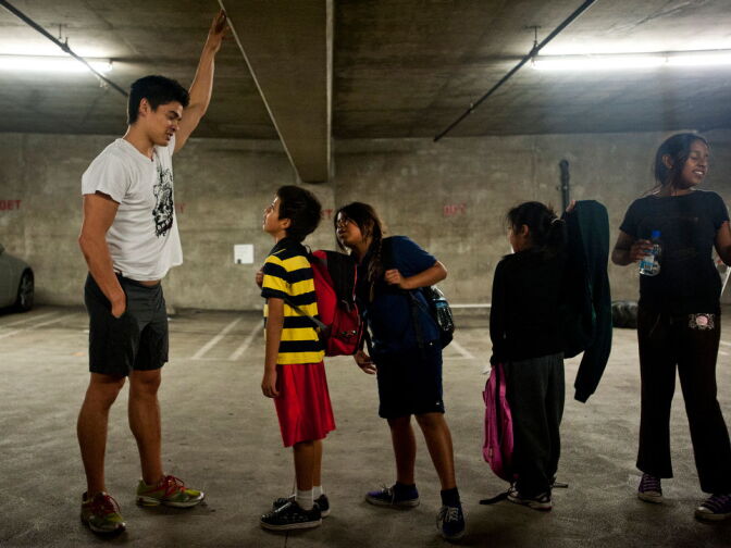 Ron Teasdale talks to kids after the hour-long class on Tuesday, Dec. 11. Teasdale is a well known CrossFit athlete.
